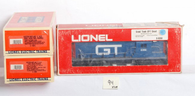 Lionel WM Alco A-A and Grand Trunk GP-7: Lionel modern O Gauge 18915 and 18916 Western Maryland Alco A-A in OBs. Look C8 however have small flash rust spots on frames. Also included 8365 Grand Trunk GP-7 dummy. C7-8. OBs have clear packing t