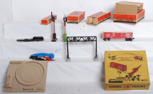 Lionel No. 6019, 470, 154, 151 in OB: Postwar O gauge Lionel No. 6019 remote control track set, 470 missile launching platform with exploding target car, 154 block signal, 450 operating signal bridge and 151 semaphore, all in original box