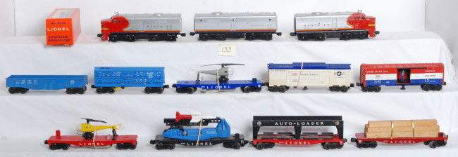 Lionel No. 218, 6825, 3419, 6630, 3665, 3376, more: Postwar Lionel O gauge Santa Fe Alco No. 218P and 218T, B unit. 6825 flatcar with custom attached lumber load, 3419 helicopter launching car w/repro copter, unnumbered helicopter launching flatcar w/b