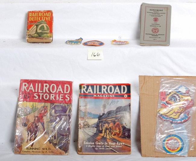 Railroad books and magazines and more: The Big Little Book Chuck Malloy Railroad Detective on the streamliner. Brotherhood of Railroad Trainmen agreement book. October 1942 Railroad Magazine. October 1933 Railroad Stories. Clown toy/puzzle