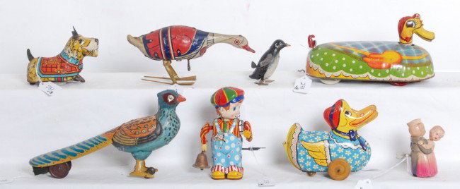 Nice lot of windup tinplate animals, Wee Scottie d: Lot of six tinplate windup mechanical toys and two windup human figure mechanical toys, one is plastic and the other is tinplate. Unmarked penguin, Marx Wee Scottie dog, Wyandotte hen, goose only mark