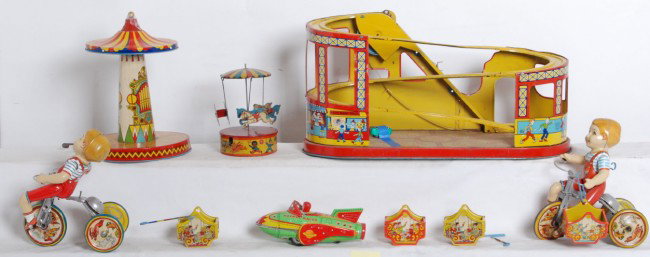 Sambo merry go round, J.Chein, Unique Art...: Large lot of tinplate toys. All are key wind mechanical, except one is a friction powered Rocket Racer. Windup merry go round Made in England, with a Little Black Sambo character on the side of base. 