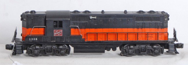 Lionel No. 2338 The Milwaukee Road GP-7: Postwar Lionel O gauge No. 2338 The Milwaukee Road GP-7 diesel switcher, very clean shell that looks nicer C8 area. Frame has battery damage.