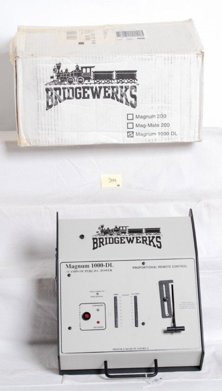 Bridgewerks Magnum 1000-DL transformer: Bridgewerks transformer for G Scale trains in OB. Transformer is Magnum 1000 DL. Transformer is C9-10 and looks unused. Comes complete with remote and antenna. OB shows light wear.