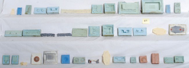 Various Lionel prototype diesel parts and molds: Lionel prototype master molds and hand made models for various diesel locomotive parts. A hand full of rubber master molds mostly for truck, pilot and roof parts included along with some hand made mod