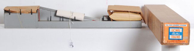 Great looking Lionel No. 364 lumber loader in OB: Postwar Lionel O gauge No. 364 lumber loader in original box with inserts, service stations pamphlet and factory sealed components envelope, C9. OB has what appears to be old ink splatters on one side