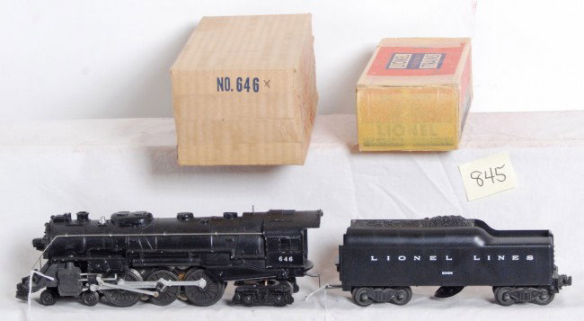 Lionel No. 646X loco and 2046W tender in OB: Postwar Lionel O gauge No. 646X steam locomotive with 2046W tender with whistle in original boxes, C7. Loco box has red marker writing and tender box has masking tape. Boxes are square and solid.