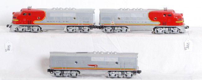 Lionel No. 2343P, 2343C, 2343T Santa Fe F3 A-B-A: Postwar Lionel O gauge No. 2343P, 2343C and 2343T Santa Fe F3 diesel A-B-A units with screened roof vents. B unit has repro porthole lens. Trains look C7 area.