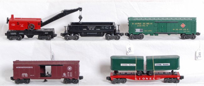 Lionel No. 3484, 3460, 6572, 3469 and 6560: Postwar Lionel O gauge No. 3484 Pennsylvania operating boxcar, 3460 flat with vans, 6572 REA reefer, 3469 dump car and 6560 operating work crane, trains look C7-8.