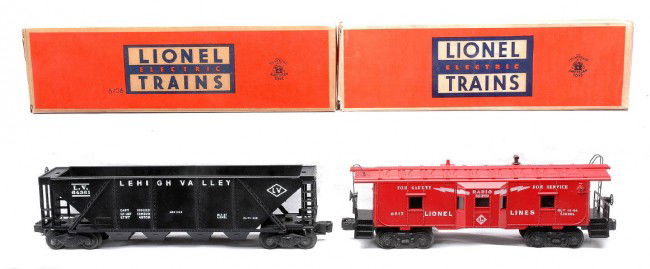Lionel 6436 LV Hopper 6517 Caboose MINT OBs: Lionel postwar 6436 black Lehigh Valley hopper with no spreader bar and a 6517 red bay window caboose both in OBs. The cars have never been run, C9-10. Both OBs have all flaps attached, except for the
