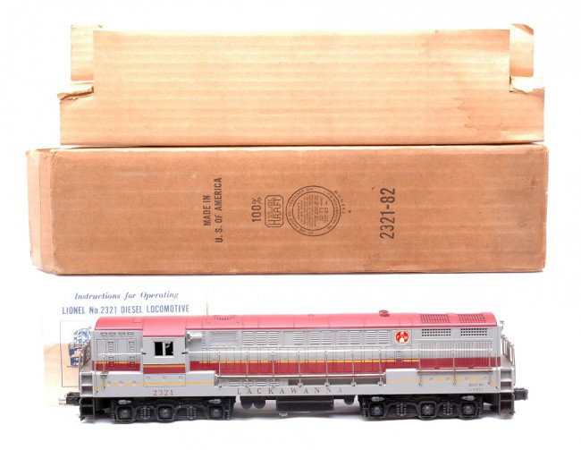 Lionel 2321 Lackawanna FM Train Master LN OB: Lionel postwar 2321 Lackawanna FM Train Master diesel that has a maroon roof in OB with original cardboard insert and instruction sheet. Both ends of the shell have screw hole cracks. The 2321 is a st