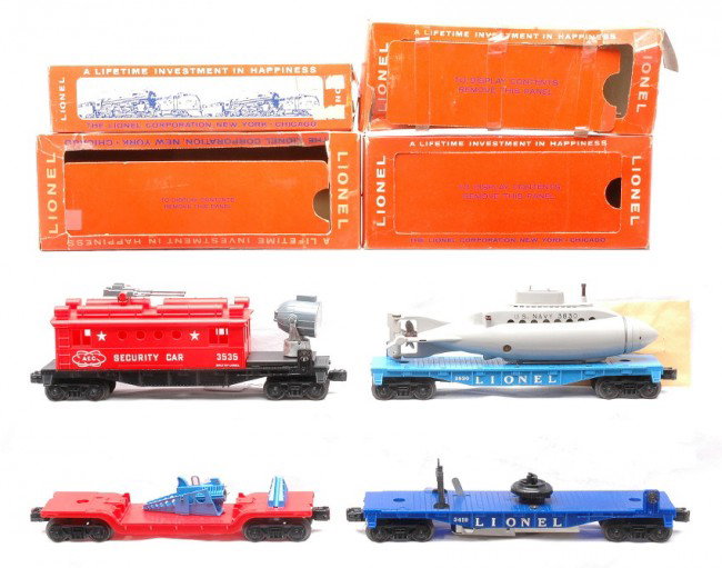 Lionel Freights 3349 3419 3830 3535 LN OBs: Lionel postwar freight cars including; 3349 turbo missile launching car missing both turbo missiles, 3419 operating helicopter car missing helicopter, 3830 flatcar with operating submarine and packet 