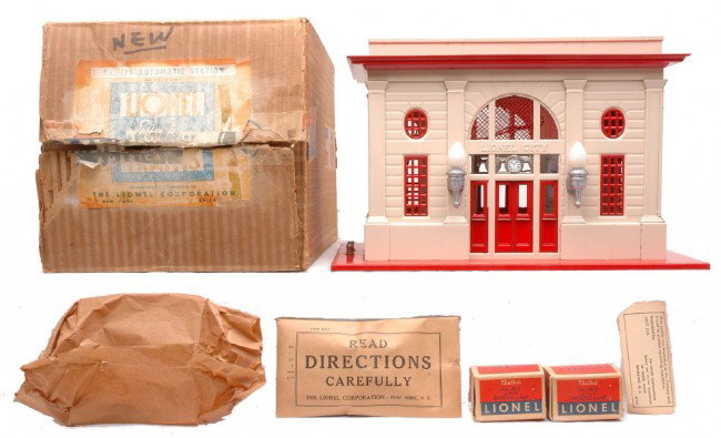 Lionel 115 Automatic Lionel City Station MINT OB: Lionel prewar 115 automatic Lionel City Station with cream walls, red base, window inserts, doors, cornice and skylight, aluminum painted lights, 115-11 factory sealed packet, inspection tag, two 40-3