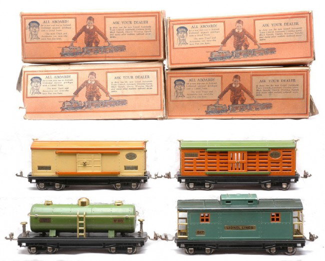 Lionel Freight Cars 813 814 815 817 Boxed: Lionel prewar O gauge freight cars including; 813 orange stock car with pea green roof, 814 cream boxcar with orange roof, 815 pea green tank car and an 817 peacock caboose with dark green roof all in