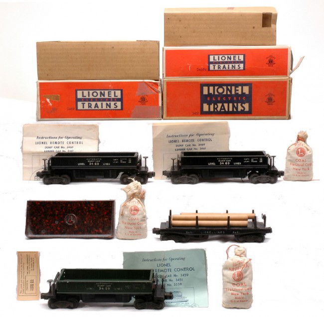 Lionel 3452 3469X 3469 3459 Operating Cars OBs: Lionel postwar 3452 automatic lumber car with wood load in OB, 3469X black automatic dump car, 3469 black automatic dumping ore car with a 160 bin both in OBs that have original cardboard inserts, ins