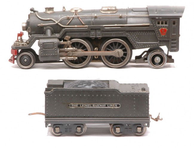 Lionel 385E Gunmetal Steam Loco 385W Tender: Lionel prewar standard gauge 385E gunmetal 2-4-2 steam loco with nickel trim and 385W die cast tender that is missing the whistle. The locoÕs frame and rear wheels have been replaced. The loco has be