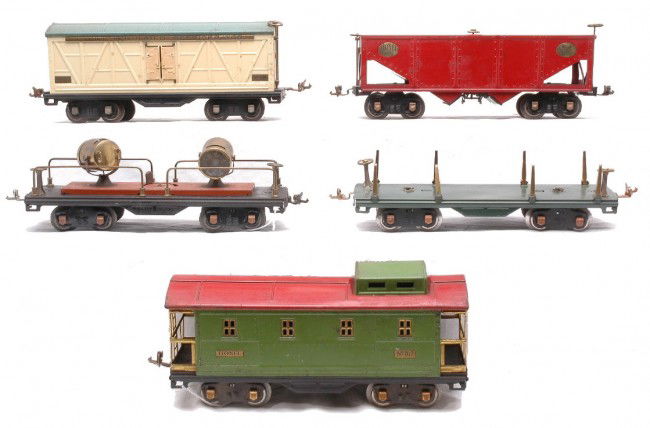 Lionel Prewar Freights 511 514 516 520 517: Lionel prewar standard gauge freight cars including; 511 dark green lumber flatcar, 514 cream refrigerator car with a peacock roof, 516 red hopper, 520 searchlight car with terra cotta base and brass