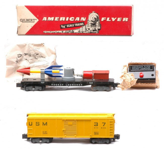 AF 25056 USM Boxcar 25045 Rocket Launcher OB: American Flyer S gauge 25056 set with the USM boxcar missing the rocket launcher flatcar. One end of the catwalk is chipped on the boxcar. Also included is a 25045 rocket launcher with button, origina