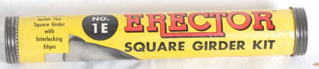 Gilbert Erector 1E square girder kit: Gilbert Erector No. 1E square girder kit in original tube. Kit is sealed and contents are C10. Tube shows light handling marks and price sticker on end. Tube is C8+. This is the very set pictured on p