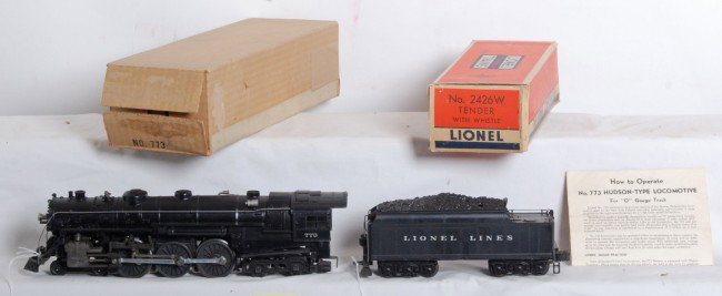 Lionel No. 773X Hudson w/2426W tender, in boxes: Postwar Lionel O gauge No. 773X Hudson steam locomotive and 2426W tender with whistle in original boxes with inserts, wrapping paper, and instructions sheet. Trains look C7-8. Tender box looks lower C