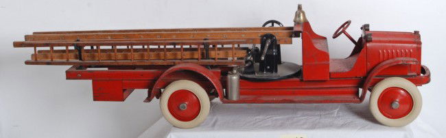 Kelmet (Gilbert) 1929 fire truck: Kelmet (Gilbert) 1929 steel fire truck toy. Truck is all original with wooden ladders and both fire extinguishers. Truck has numerous paint chips, and Big Boy decals on both running boards have some c