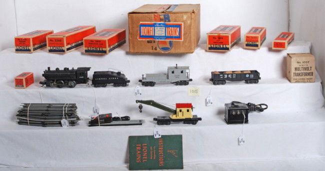 Lionel No. 1407B switcher freight set in OB: Prewar Lionel O gauge No. 1407B switcher freight set in original boxes. 1665 steam switcher, 2403B tender w/bell, 2452X Pennsylvania gondola w/three wooden barrels, 2560 operating work crane, 2419 Del