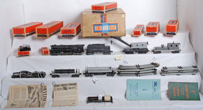 Lionel No. 2111WS freight outfit in OB w/671, 671: Postwar Lionel O gauge No. 2111WS freight set in original boxes with components. Trains are 671 locomotive with smoke chamber, 671W tender with whistle, 3469 automatic dumping ore car, 2411 flatcar w/