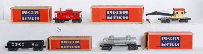 Lionel No. 2560, 2465, 2452, 2457 in OB: Postwar Lionel O gauge No. 2560 operating work crane, 2465 Sunoco tank, 2452 Pennsylvania gondola, and 2457 Pennsylvania caboose, in original boxes. Trains look C7 area. Boxes have missing flaps, wear