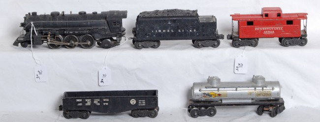Lionel No. 1666, 2466T, 2452, 2465, 2472: Postwar Lionel O gauge No. 1666 steam loco, 2466T tender without whistle, 2452 Pennsylvania gondola (missing a coupler), 2465 Sunoco tank (missing couplers) and 2472 Pennsylvania caboose. Trains shoul