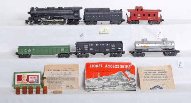 Lionel No. 2055, 6026W, 6456, 6462, 6465, 6257: Postwar O gauge Lionel No. 2055 steam loco with smoke tamper, 6026W tender with whistle, 6456 LV hopper, 6462 NYC gondola with five wooden barrels, 6465 Sunoco tank and 6257 caboose. Trains are very c