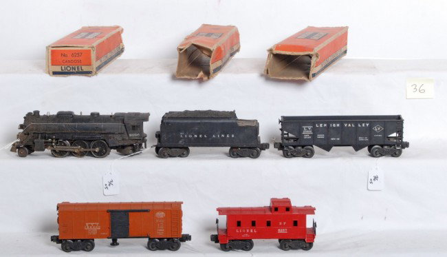 Lionel No. 2026, 6466WX, 6456, 3464, 6257, w/3 OB: Postwar Lionel O gauge No. 2026 steam locomotive, 6466WX tender with whistle, 6456 LV hopper, X3464 NYC operating boxcar and 6257 SP caboose with cracked shell. Trains should clean to look C6 area. 34
