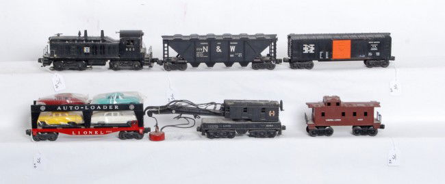 Lionel No. 623, 6460, 6414, 6446, 6464-425, 6017: Postwar Lionel O gauge No. 623 Santa Fe NW-2 diesel switcher, C5-6. 6460 operating work crane, sold as is with no return. 6414 Evans Auto-Loader with reproduction autos, C6+. 6446-25 Norfolk and Weste