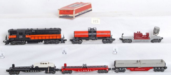 Lionel No. 2338, 6424, 6430, 3359, 6520, 6315: Postwar Lionel O gauge No. 2338 The Milwaukee Road GP-7 road switching diesel with 6424 auto flatcar w/one correct length original auto (painted front bumper), 6430 trailer flat, 3359 twin bin dump ca