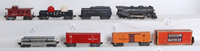 Lionel No. 2018, tender, 6112, 2454, flat, 6014, 6: Postwar Lionel O gauge No. 2018, tender w/o whistle, 6112 w/two canisters, X2454, unnumbered flat with pipes, X6014 PRR Baby Ruth boxcar and a 6017 caboose. Trains look C5-6 with some oxidation/rust o