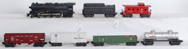Lionel No. 2055, 6026W, 6456, 6462, 6465, X6014, 6: Postwar Lionel O gauge No. 2055 steam loco, 6026W tender w/whistle, 6456 LV hopper, 6462 NYC gondola w/four wooden barrels, 6465 Sunoco tank, X6014 PRR Baby Ruth boxcar, and 6257 caboose. Loco is miss