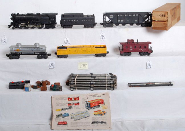 Lionel No. 2065 steam, W/tender, 3562-50, 6436...: Postwar Lionel O gauge No. 2065 steam locomotive in original box with an unnumbered tender with whistle, 3562-50 A.T.S.F. barrel car with six wooden barrels, 6436 LV hopper, 6465 Sunoco tank, and 6357