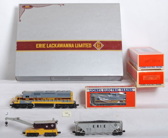 Partial Lionel 1405 Erie Lackawanna set: Lionel modern O gauge partial 1405 Erie Lackawanna set. Includes 8458 SD40 box only, 18202 add on dummy SD40 in C7+ condition, 6118 hopper no box, 6524 crane no box, and 6906 caboose in OB. Items are 