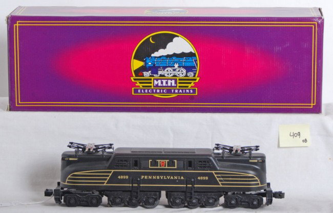MTH Pennsylvania MT-5103L GG1: MTH modern O Gauge Pennsylvania GG1 in OB. Catalog number is MT-5103L. Loco features horn, directional lighting, dual motors, and much more. Loco is C8 condition with some run time. OB has sticker at 