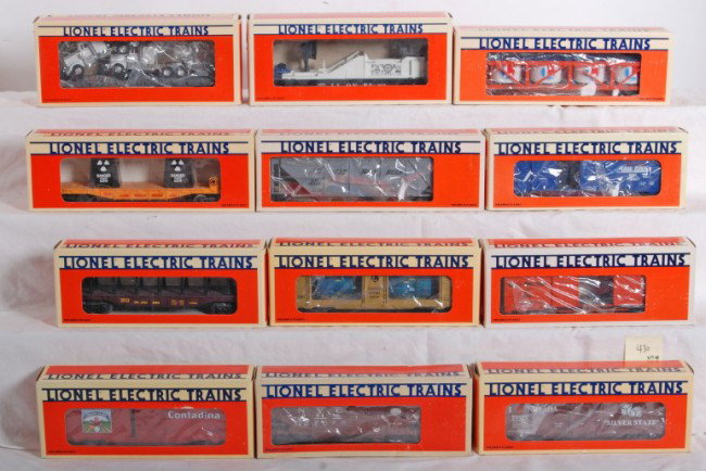 12 Lionel freight cars 16666, 19926, etc.: Lionel modern era O Gauge freight cars including 16670 TV car, 19420 Lionel Lionel vat car, 19926 I Love Nevada boxcar, 19304 Great Northern hopper, 19251 Montana Rail Link boxcar, 16666 toxic waste c