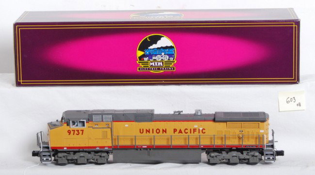 MTH Union Pacific Dash 9 with Proto 2: MTH modern O Gauge Union Pacific Dash 9 in OB. Loco is catalog number 20-2270-1. Loco features Protosound 2.0, DCS control, Protosmoke, Protocouplers, and much more. Loco looks C8 however is missing o