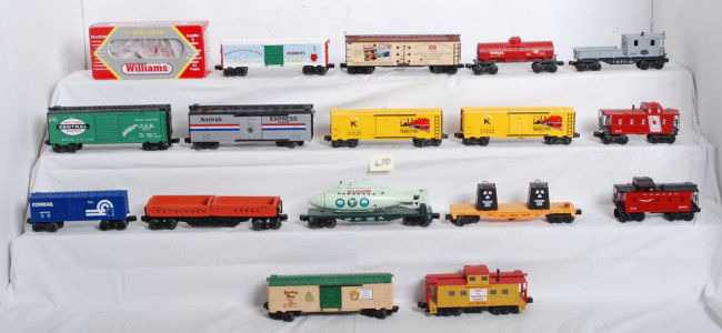 17 mixed Lionel, K Line, MTH cars: Mixed lot of modern O Gauge freight cars. Seventeen cars total. Includes 9001 Conrail boxcar, Lionel? Bethlehem operating dump car, 25506 Union Pacific caboose, 6871 Monopoly submarine car, 16666 toxi