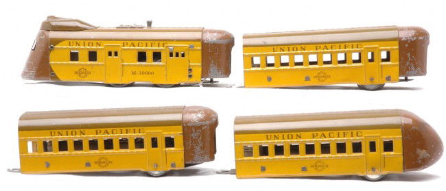 Hafner Overland Flyer UP Zephyr Pass Set M-10000: Hafner Overland Flyer prewar O gauge yellow and brown Union Pacific Zephyr streamliner passenger set no. M-10000 including; clockwork power car, two coaches and an observation car. The set is C6.
