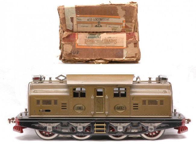 Lionel Std. Ga. 402 Mojave Electric Loco OB: Lionel prewar standard gauge 402 Mojave 0-4-4-0 electric loco with a dual motor in OB. Both headlights have been replaced and the loco has been rewheeled. The loco is C5-6. The OB is worn.