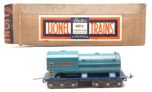 Lionel 400W Blue Comet Whistle Tender Boxed: Lionel prewar standard gauge 400W Blue Comet whistle tender with nickel and brass trim and nickel journals in OB. The draw bar and coupler have some surface rust. The tender is C7. The OB has a bright