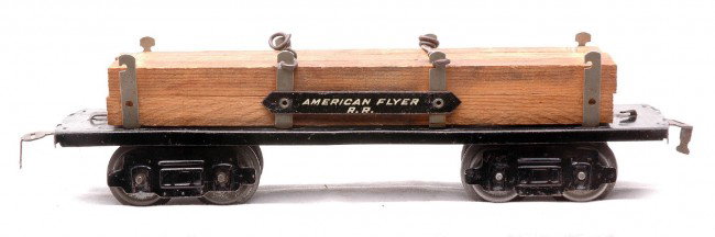 Am Flyer 9 1/2 Inch 3006 Log Car with Wood Load: American Flyer prewar O gauge nine and a half inch 3006 log car with AMERICAN FLYER R.R. metal plate mounted between posts, circa 1924. The car has a wood load. The car is C6.