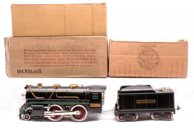 Lionel Black 384E 390T w/Green Stripes OBs: Lionel prewar standard gauge 384E black 2-4-0 loco and 390T tender both with green stripes in OBs with original cardboard inserts. The original wheels on loco are starting to disintegrate. The loco an