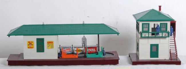 Lionel 356 w/carts and 445 operating accessories: Postwar Lionel O gauge operating accessories, 356 operating freight station with two carts and 445 operating switch tower, C6 area.