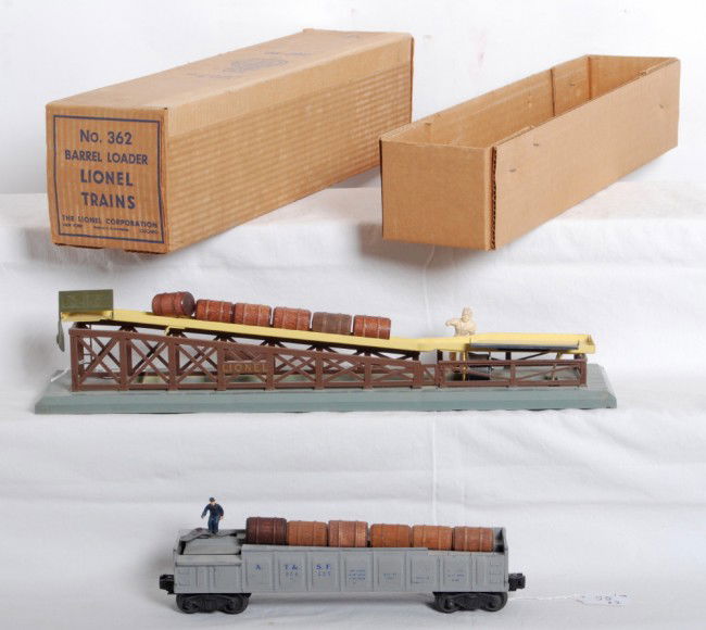 Lionel No. 362 in OB and No. 3562-25 A.T.S.F.: Postwar Lionel O gauge No. 362 barrel loader in original box with insert, six wooden barrels and adjusting clip, C6. No. 3562-25 A.T.S.F. operating barrel car with six wooden barrels, C6. 362 OB looks