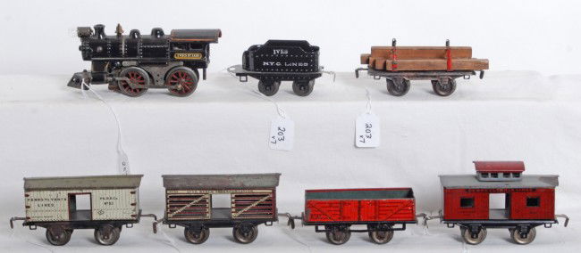 Ives 1118, 11, flatcar, 53, 54, 55, 56 steam freig: Prewar Lionel O gauge No. 1118 cast iron steam locomotive, 11 tinplate N.Y.C. Lines tender, flatcar with lumber and restraints, 53 Pennsylvania Lines boxcar, 54 gondola, 55 Live Stock Transportation,