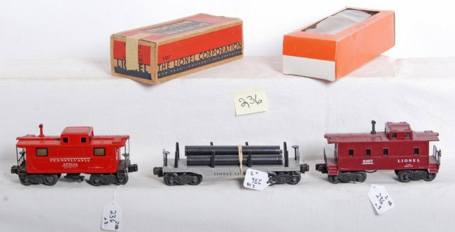 Lionel No. 6357, 2457 in OB, 2411 w/pipes: Postwar Lionel O gauge No. 6357 caboose, 2457 Pennsylvania caboose in OB missing flaps, and 2411 flatcar with original pipes, C6.